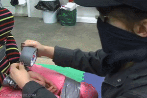 www.escapevideos.com - Nastasia Duct Tape Chair thumbnail